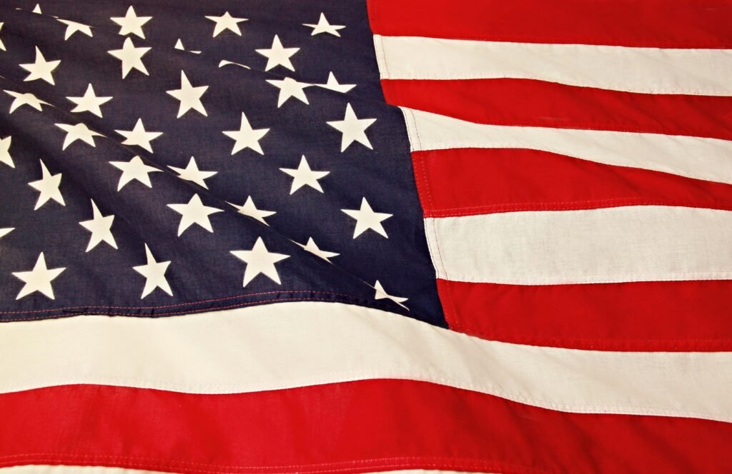 pexels-photo-1202723-1202723 Detailed image of the American flag showcasing the stars and stripes symbolizing USA's patriotism and pride.