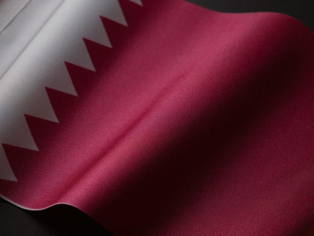 pexels-photo-16034033-16034033 A detailed close-up of the Qatar national flag showcasing its unique design and colors.